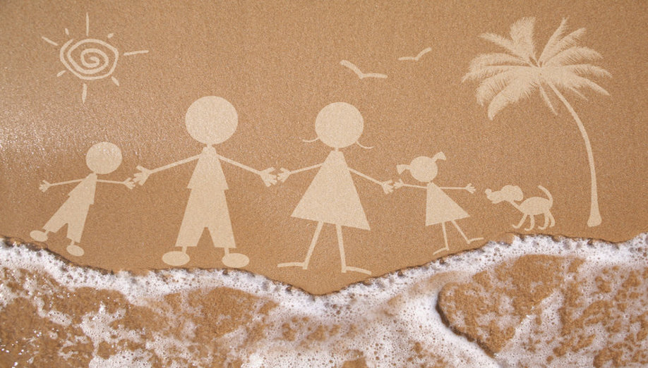 Summer family vacation concept on wet sand texture